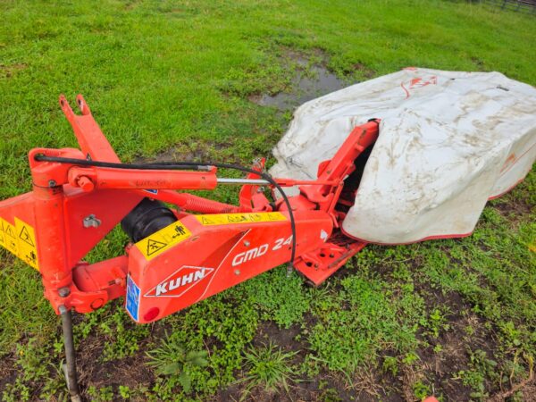Used Kuhn GMD 240 disc mower with PTO and side cutter in working condition on grassy field