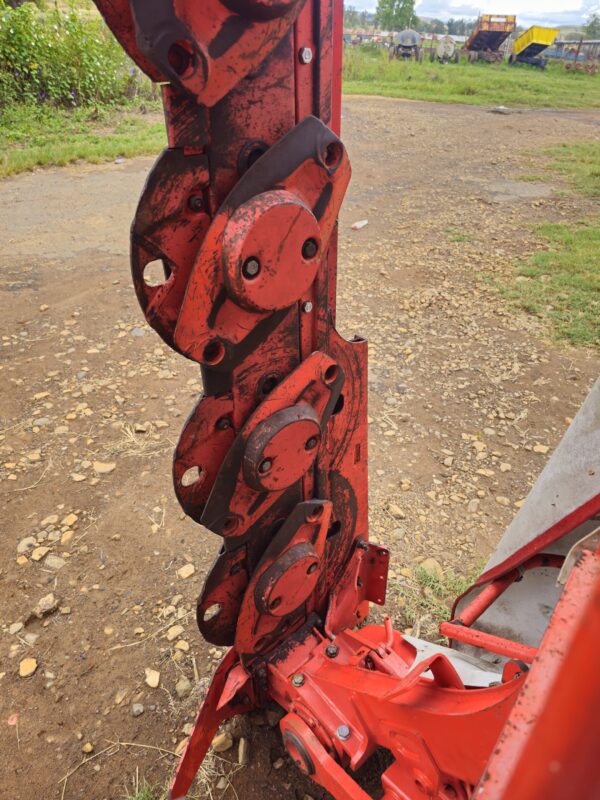 Used Kuhn GMD 240 disc mower with PTO and side cutter in working condition on grassy field