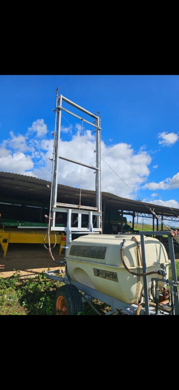 Used Jacto mister sprayer for Pecan Nut trees on farm in South Africa under blue sky