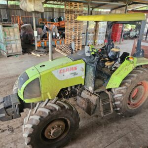 Second-hand 4x4 Claas Celtis 456 tractor in working condition, available in KwaZulu-Natal, South Africa, parked inside a farm equipment shed.