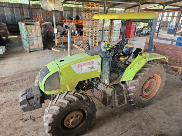 Second-hand 4x4 Claas Celtis 456 tractor in working condition, available in KwaZulu-Natal, South Africa, parked inside a farm equipment shed.