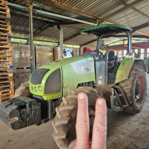 Second used Claas Celtis 456 4x4 tractor in muddy working condition, photographed indoors at a farm equipment facility in KwaZulu-Natal, South Africa.
